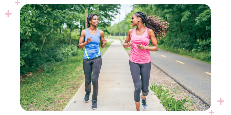 Two friends jogging together outdoors