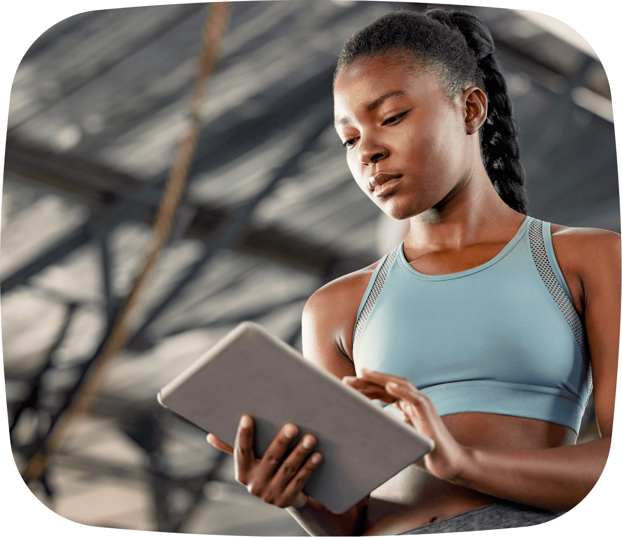 A business owner checking TeamUp AI Business Advisor in their gym