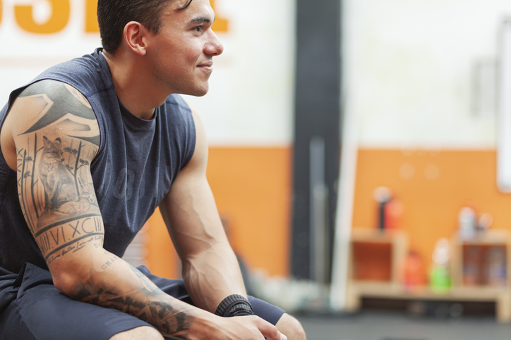 A man sitting at the gym.